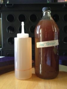 Herbal infused vinegar + finished hair rinse in application bottle.